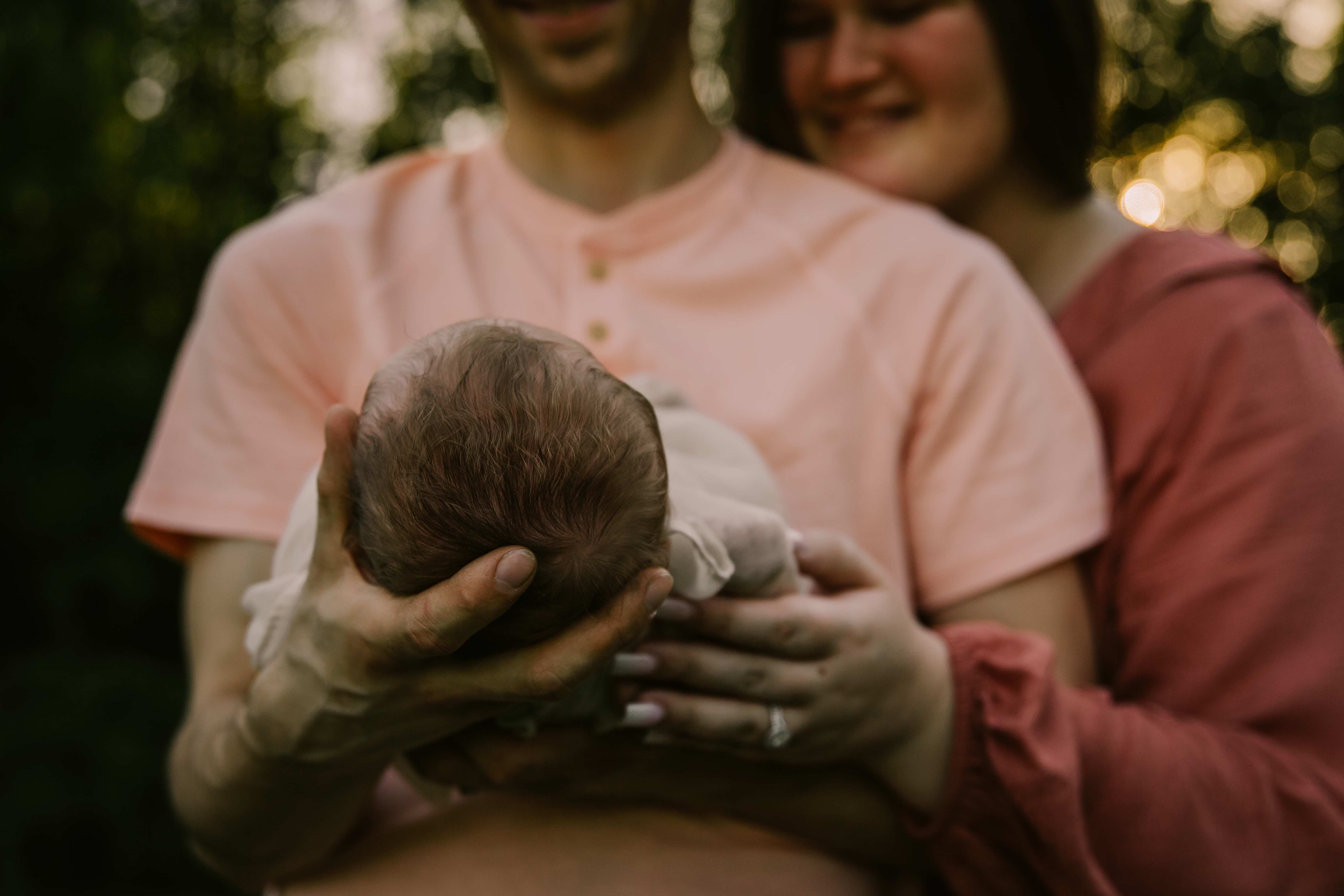 Parents holding newborn
