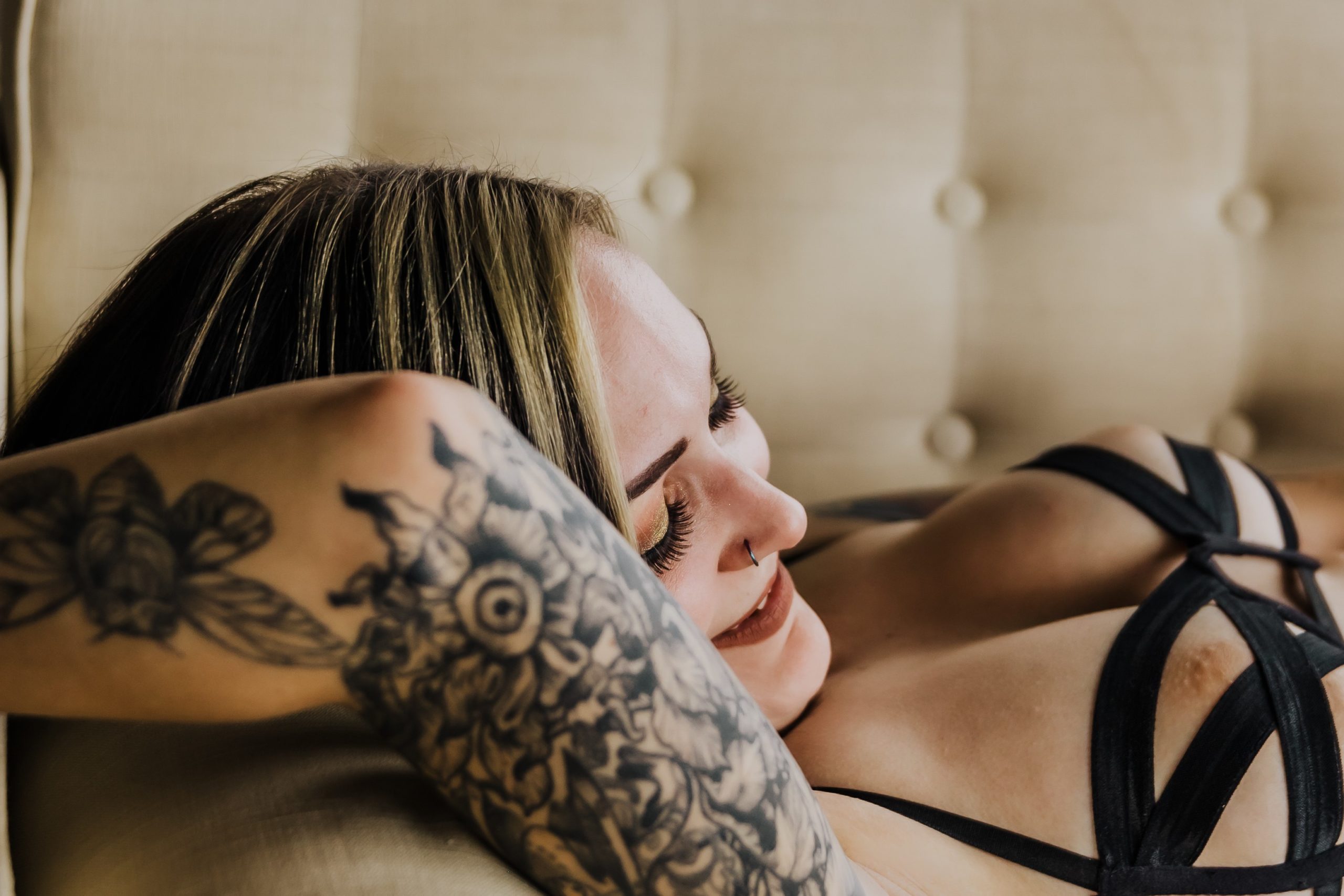 woman smiling arm with tattoos